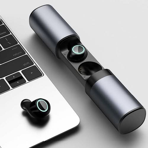 True Twin 2 In 1 wireless headphones with charging case next to laptop