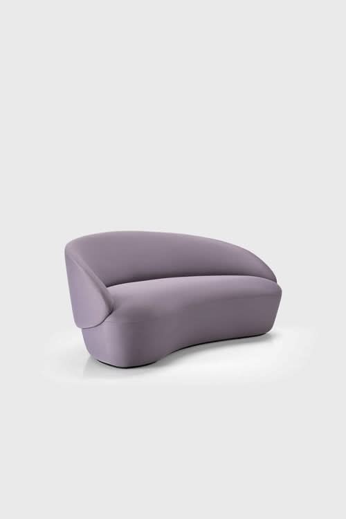 Naïve Sofa in lavender with curved rounded form and padded seat