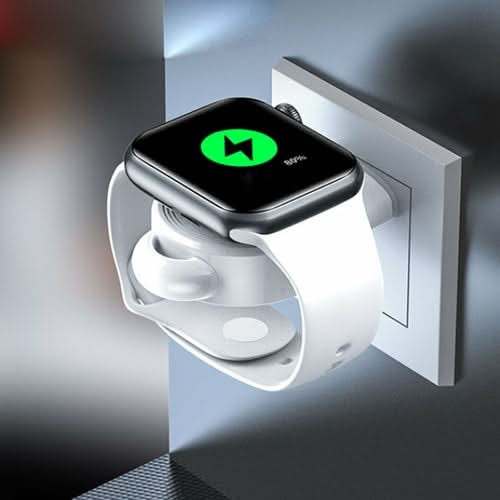 Apple iWatch USB Charger mounted on wall outlet with white band and green icon on display