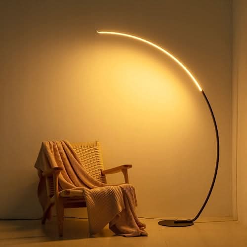 RGBW Modern Curve Floor Lamp with warm white glow illuminating reading chair
