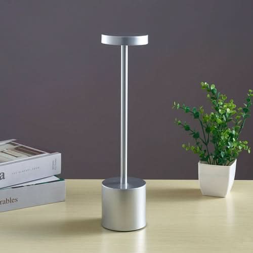 Nordic I-shaped bedroom LED touch bar lamp on table with books and potted plant
