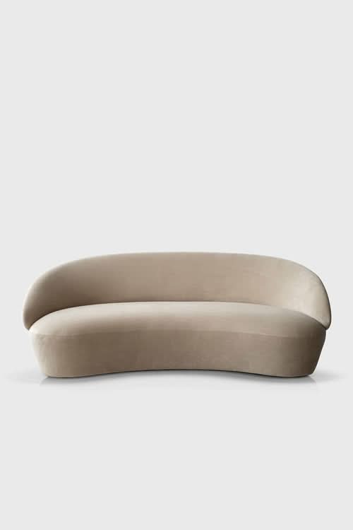 Naïve Sofa, curved cream-colored upholstered seating with rounded arms