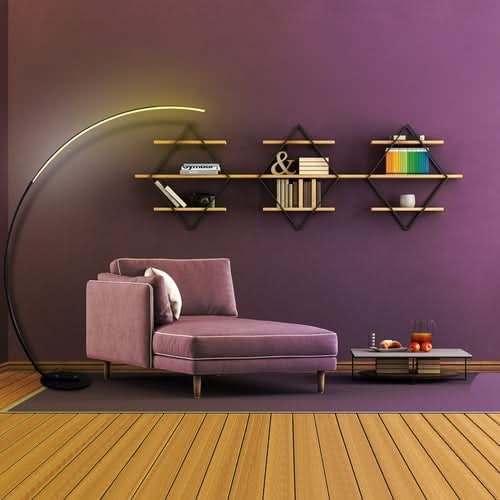 RGBW Modern Curve Floor Lamp in room with purple wall, shelving, and pink seating