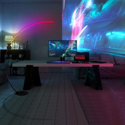 RGBW Modern Curve Floor Lamp illuminating gaming desk setup with pink and blue neon lighting