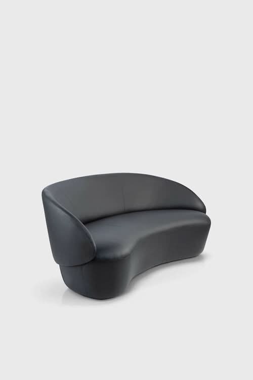 Naïve Sofa curved black seating furniture with rounded armrests and cushioned seat