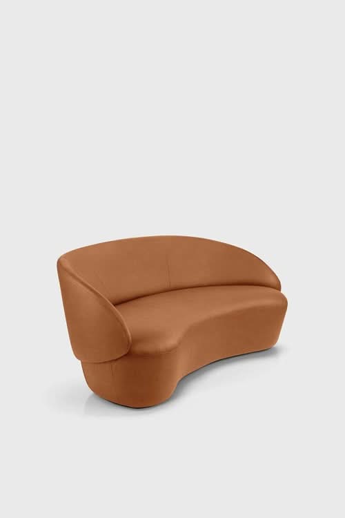 Naïve Sofa in tan leather with curved sides and rounded back