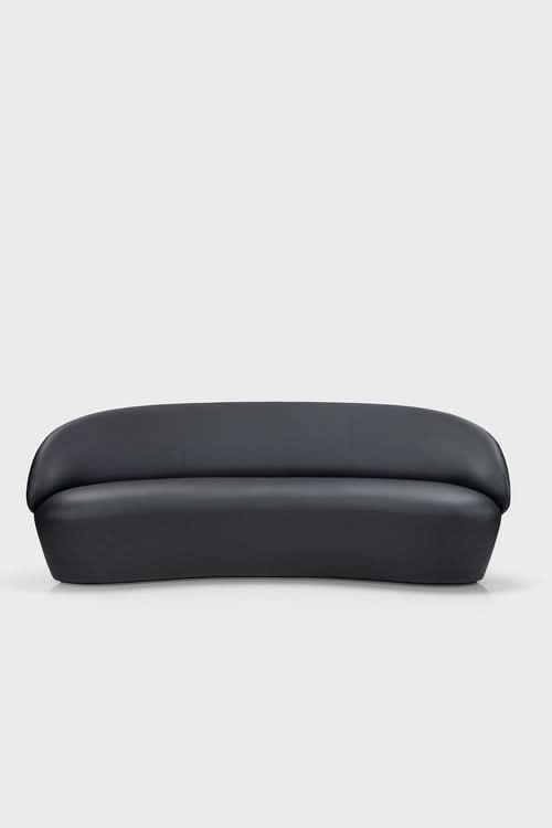 Naïve Sofa in dark gray, curved design with rounded arms and quilted back