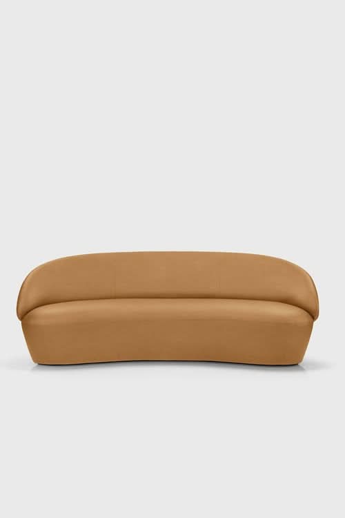 Naïve Sofa in tan with curved design, front view against neutral background