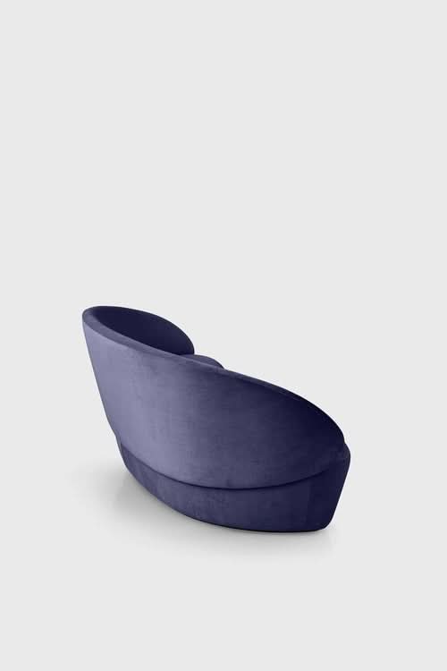 Naïve Sofa in navy blue, curved contemporary design with angled backrest