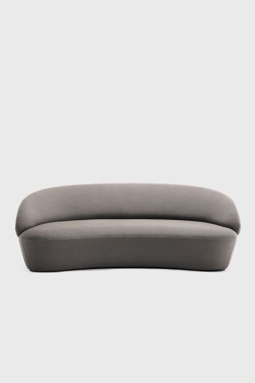Naïve Sofa with curved gray upholstered frame, side view