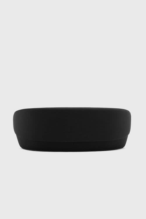 Naïve Sofa in black, viewed from the side against a light background