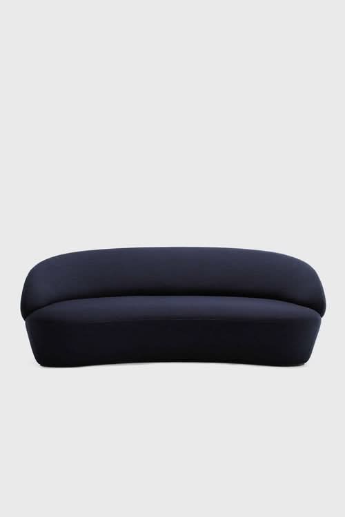 Naïve Sofa in dark navy with curved, rounded silhouette