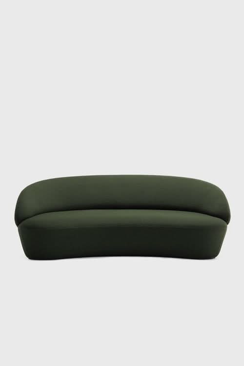 Naïve Sofa in forest green with curved, rounded form