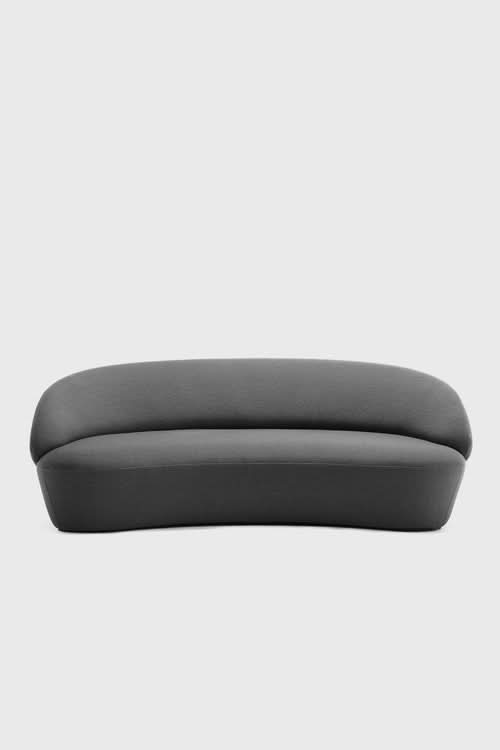 Naïve Sofa in charcoal gray with curved, rounded form and upholstered seating