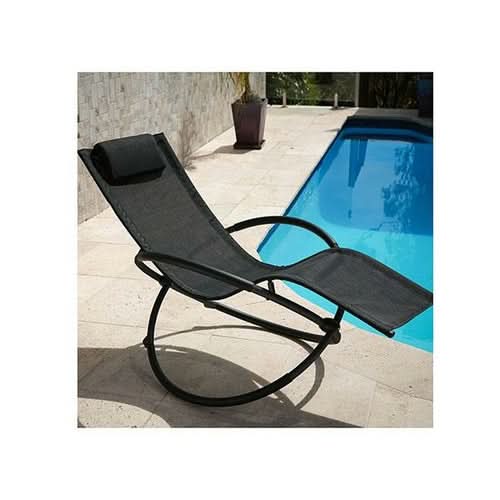 Black foldable rocking chair with footrest by poolside