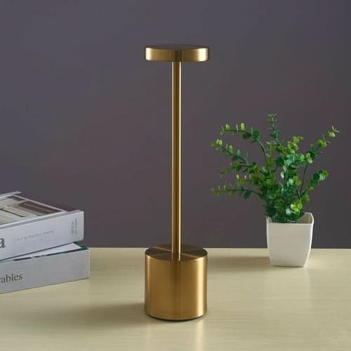 Nordic I-shaped LED touch bar lamp with cylindrical base on desk next to books and potted plant