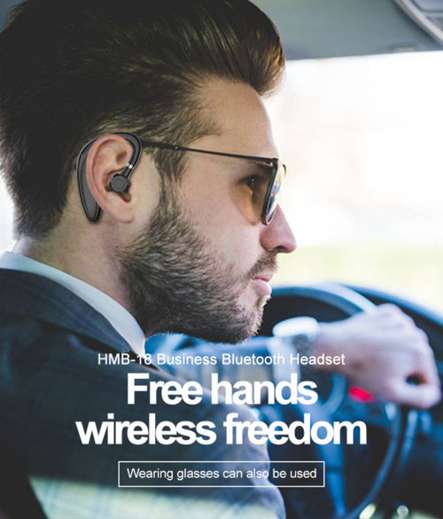 Man wearing wireless Bluetooth headset and glasses while driving