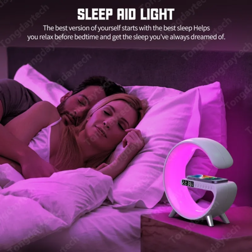 Multifunctional Wireless Charger Alarm Clock Speaker with app control emitting pink light in bedroom setting
