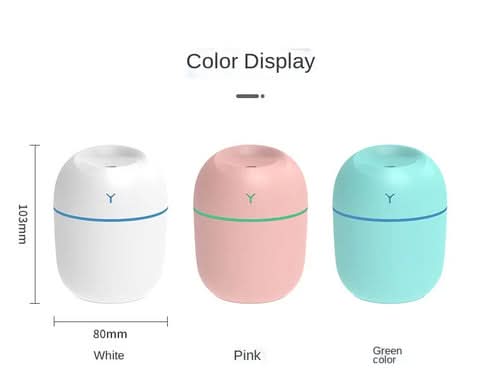 Three portable ultrasonic humidifiers in white, pink, and green with LED displays and essential oil diffuser tops