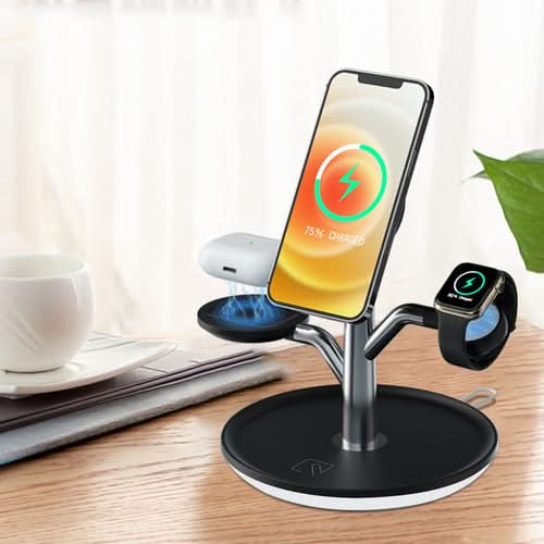Universal wireless charging stand holding smartphone, smartwatch, and earbuds on desk