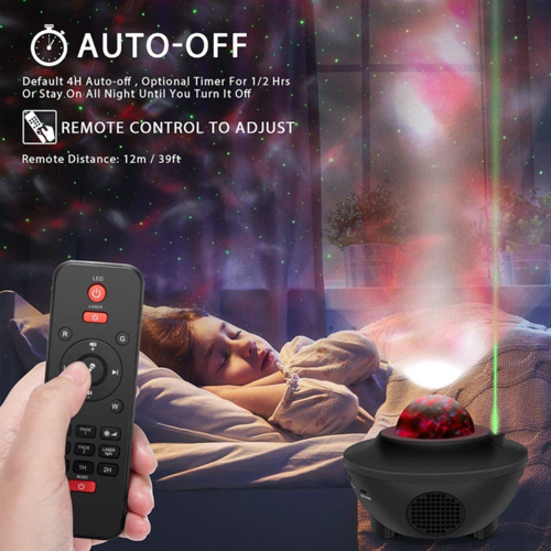 Remote control held next to galaxy projector casting colorful starry sky lights onto bedroom wall