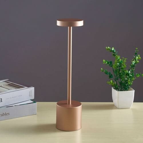 Nordic I-shaped LED touch bar lamp on light wood surface with books and potted plant